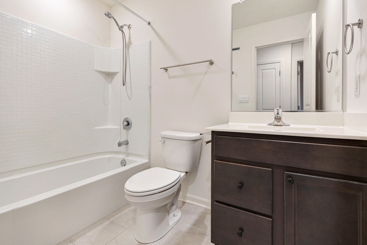 2016 Yellowstone Boulevard Mundelein, IL 60060 - Photo 19 of 26 a bathroom with a sink a toilet and shower