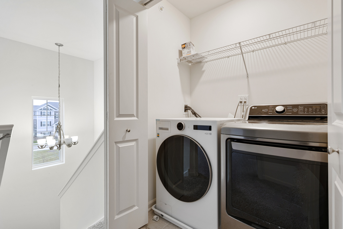 2016 Yellowstone Boulevard Mundelein, IL 60060 - Photo 21 of 26 a view of a storage and utility room with washer and dryer