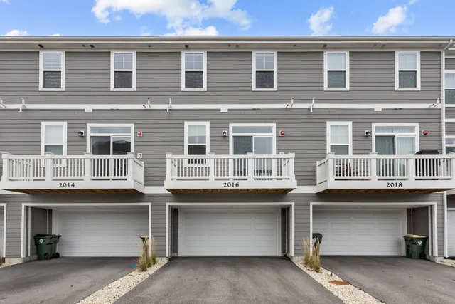 a front view of a building with a lot of windows
