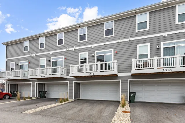 a front view of a building with a lot of windows