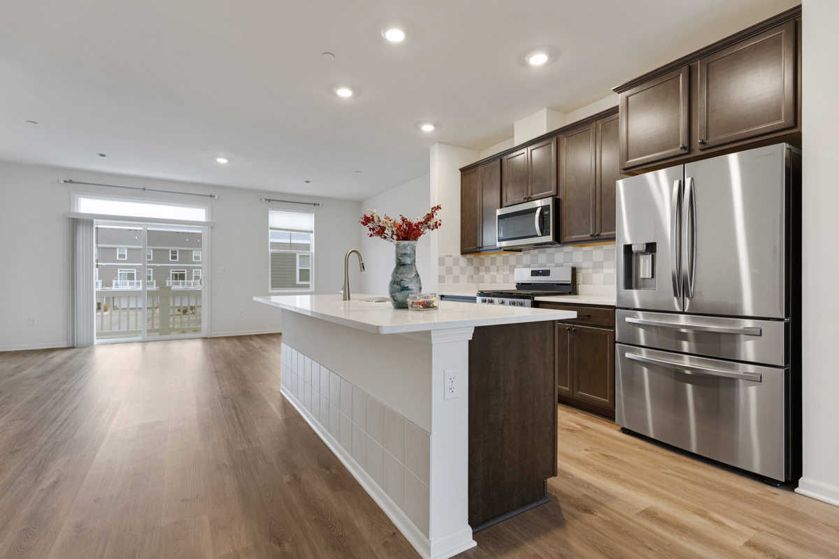 2016 Yellowstone Boulevard Mundelein, IL 60060 - Photo 7 of 26 a kitchen with stainless steel appliances granite countertop a refrigerator a sink dishwasher a stove and a refrigerator with wooden floor