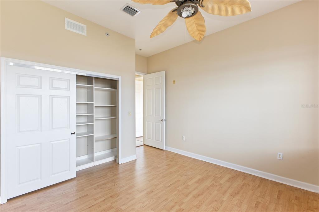 8755 The Esplanade, Unit 126 Orlando, FL 32836 - Photo 11 of 30 a view of empty room with wooden floor and cabinet