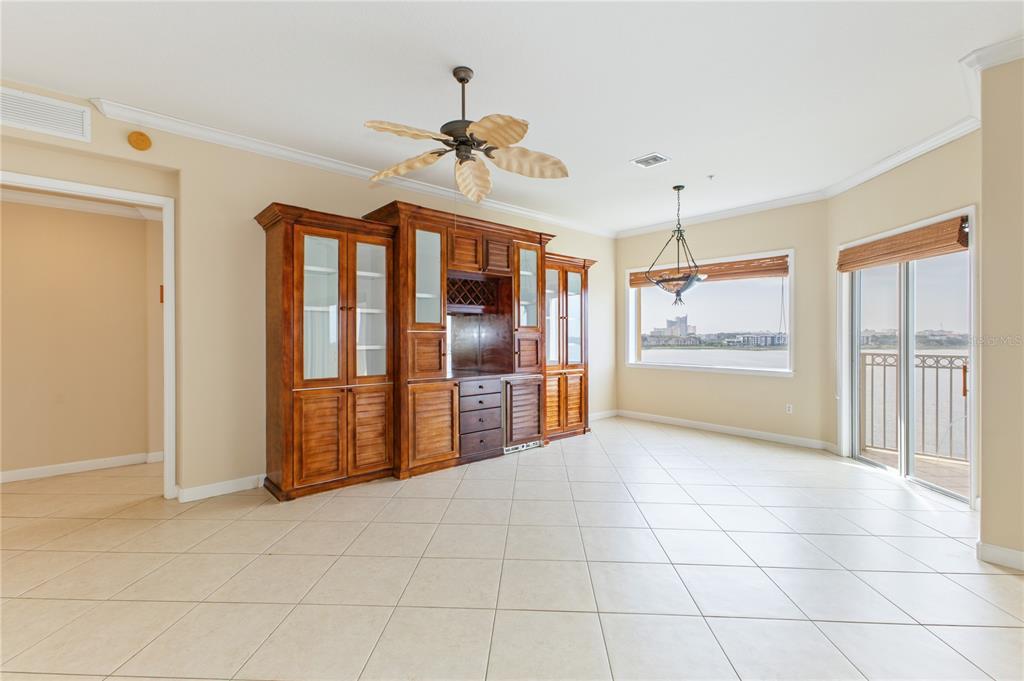 8755 The Esplanade, Unit 126 Orlando, FL 32836 - Photo 19 of 30 a living room with stainless steel appliances kitchen island granite countertop a refrigerator and a sink
