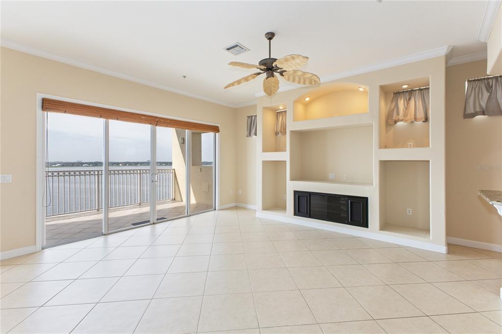 8755 The Esplanade, Unit 126 Orlando, FL 32836 - Photo 20 of 30 a view of an empty room with a fireplace and a window