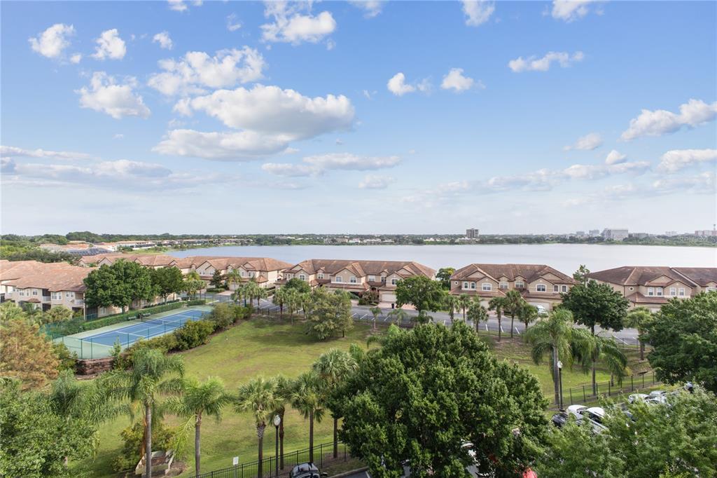 8755 The Esplanade, Unit 126 Orlando, FL 32836 - Photo 2 of 30 a view of a lake in middle of forest