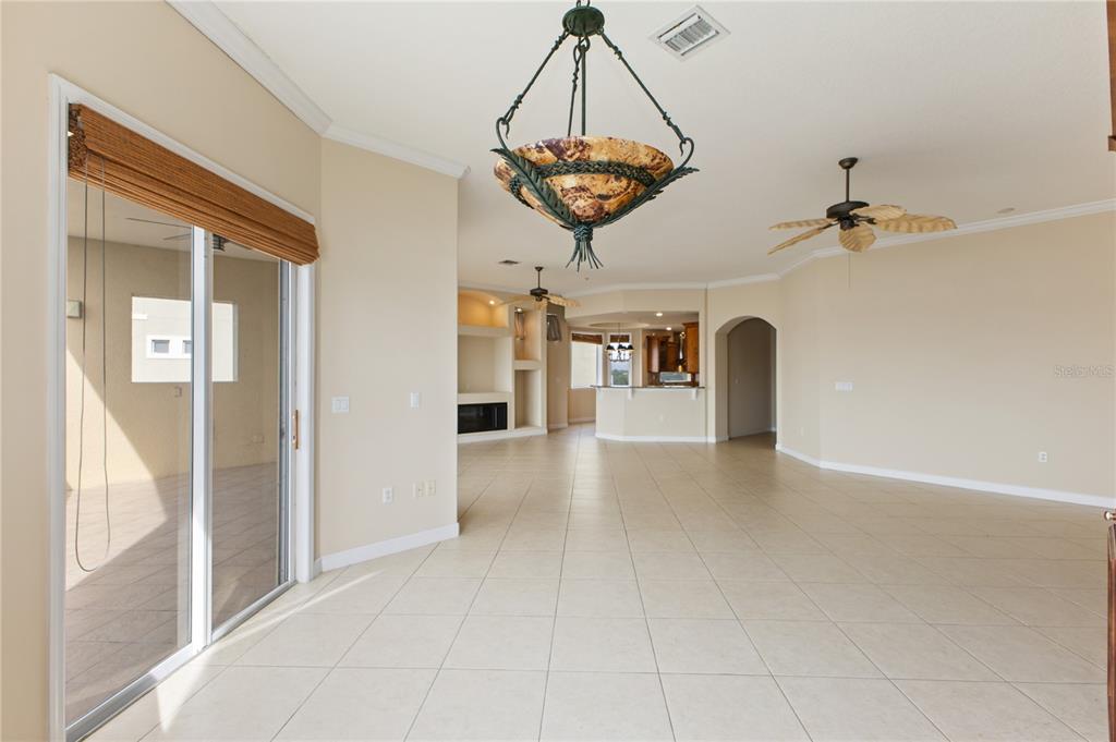 8755 The Esplanade, Unit 126 Orlando, FL 32836 - Photo 22 of 30 a view of a hallway with a chandelier and a chandelier