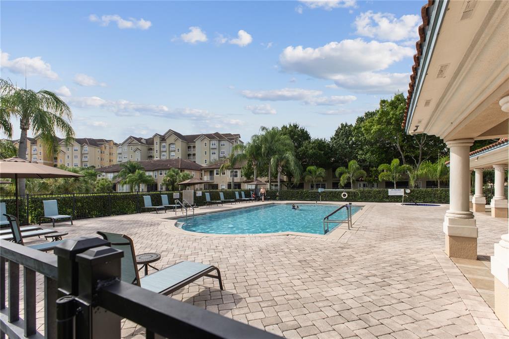 8755 The Esplanade, Unit 126 Orlando, FL 32836 - Photo 29 of 30 a view of backyard with swimming pool and outdoor seating