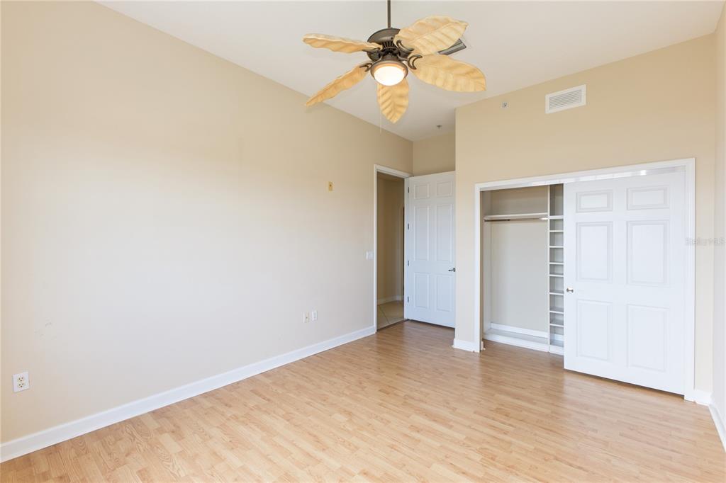 8755 The Esplanade, Unit 126 Orlando, FL 32836 - Photo 9 of 30 wooden floor in an empty room with a window