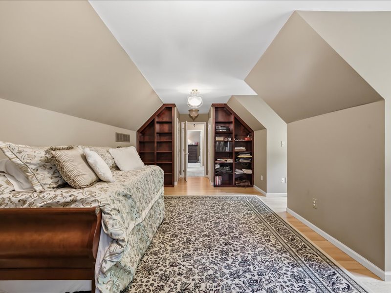1168 Mt Pleasant Road Bangor, PA 18013 - Photo 68 of 100 Custom built-in bookcases and classic wood flooring define this upper-level space under vaulted ceilings.