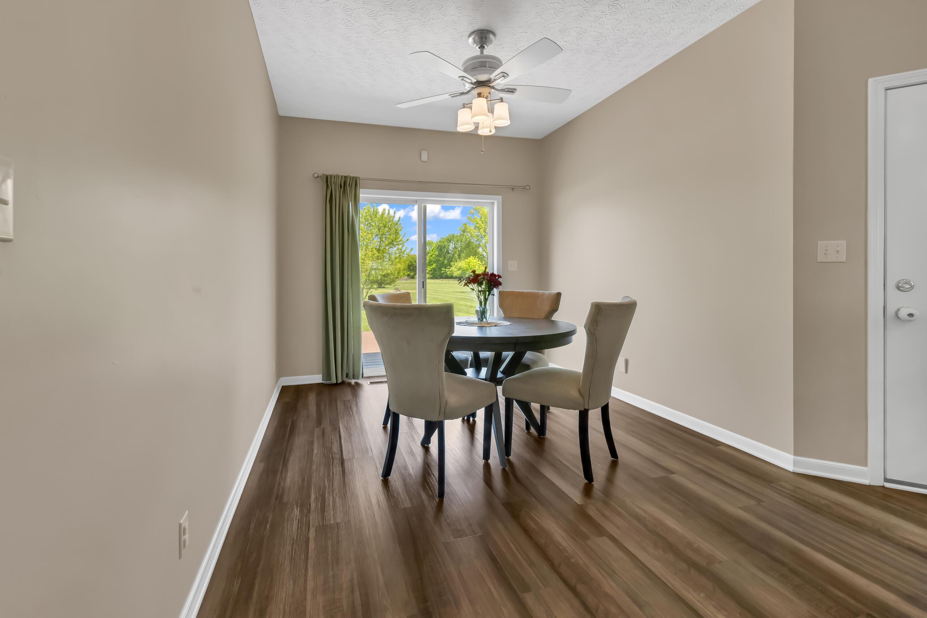 14396 Blamer Road Johnstown, OH 43031 - Photo 18 of 48 • Luxury vinyl plank flooring
• Tan painted walls
• Lighted ceiling fan
• Double sliding doors to
deck
• Atrium door to deck