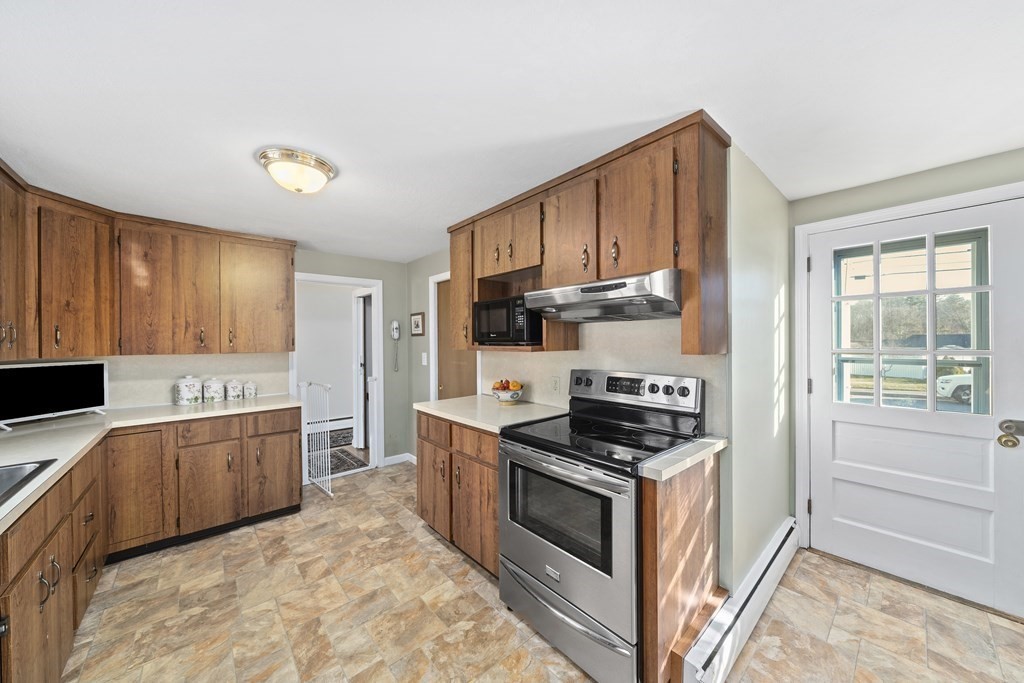 57 Norfolk Road Braintree, MA 02184 - Photo 11 of 30 a kitchen with stainless steel appliances granite countertop a stove a sink and a refrigerator