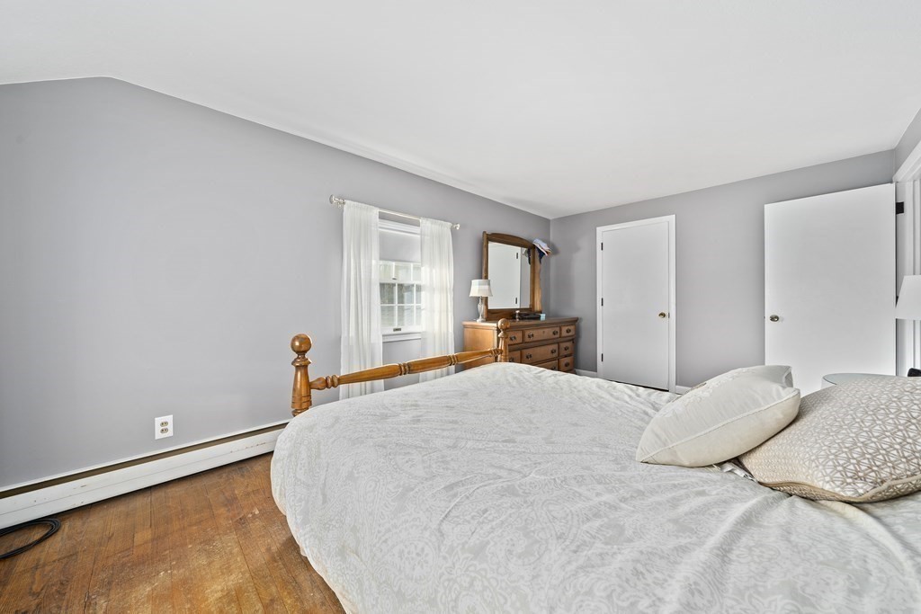 57 Norfolk Road Braintree, MA 02184 - Photo 13 of 30 a bedroom with a bed and a dresser