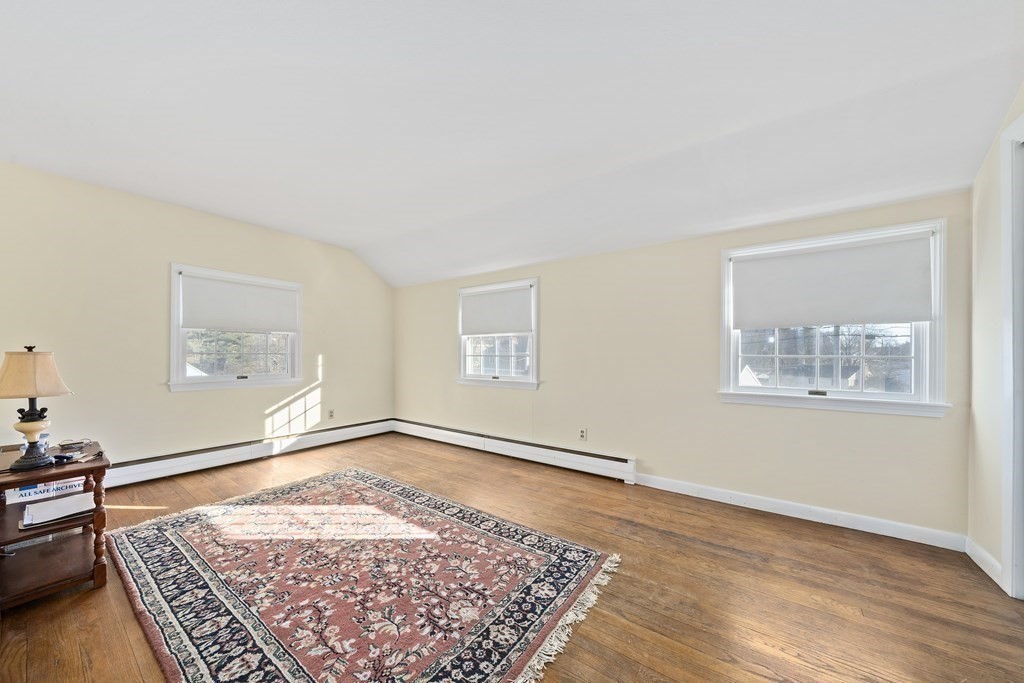 57 Norfolk Road Braintree, MA 02184 - Photo 14 of 30 a view of an empty room with a rug and a window