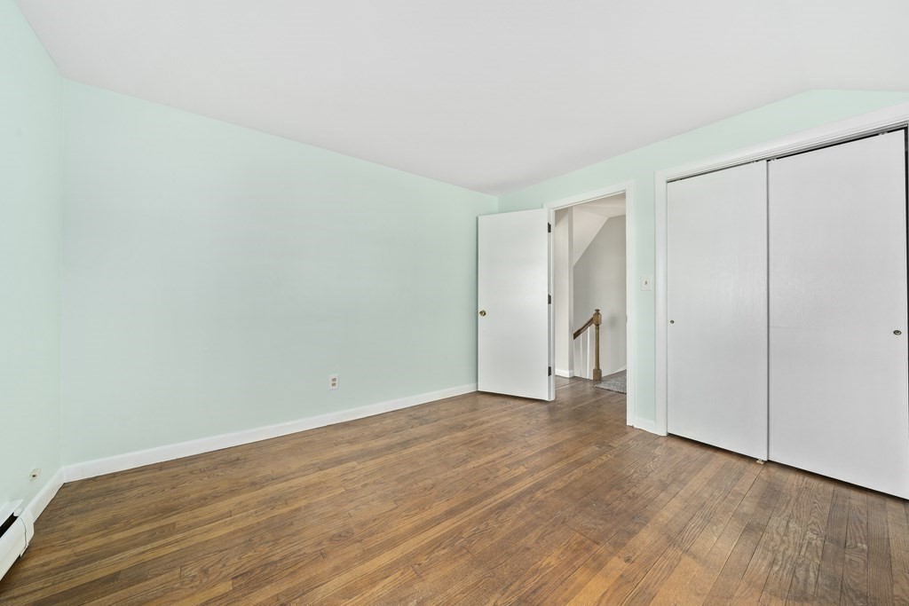 57 Norfolk Road Braintree, MA 02184 - Photo 16 of 30 a view of an empty room with wooden floor