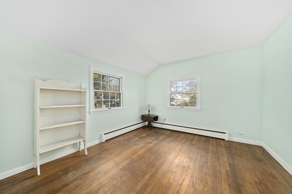 57 Norfolk Road Braintree, MA 02184 - Photo 17 of 30 a view of an empty room with a window and wooden floor