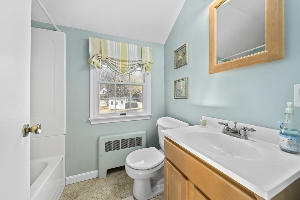 57 Norfolk Road Braintree, MA 02184 - Photo 18 of 30 a bathroom with a sink toilet and a mirror