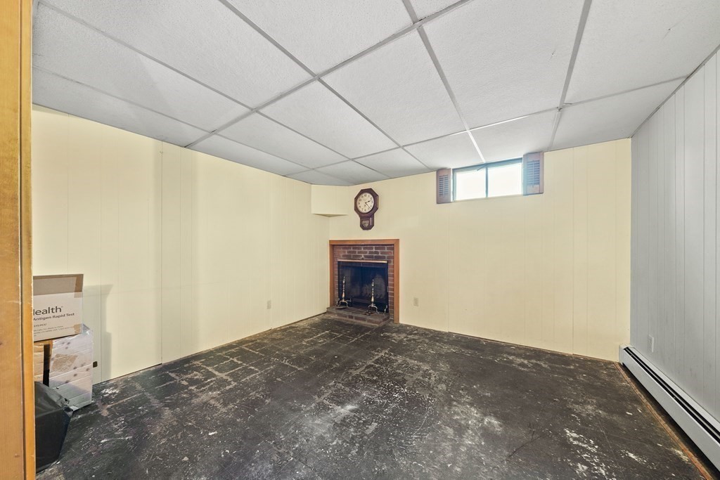 57 Norfolk Road Braintree, MA 02184 - Photo 19 of 30 a view of an empty room with a fireplace