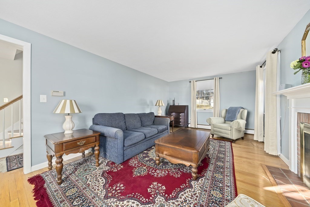 57 Norfolk Road Braintree, MA 02184 - Photo 4 of 30 a living room with furniture wooden floor and a rug