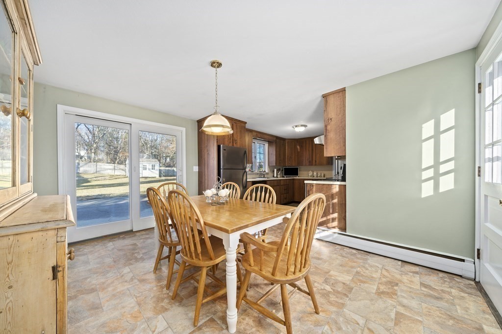 57 Norfolk Road Braintree, MA 02184 - Photo 9 of 30 a view of a dining room with furniture window and outside view