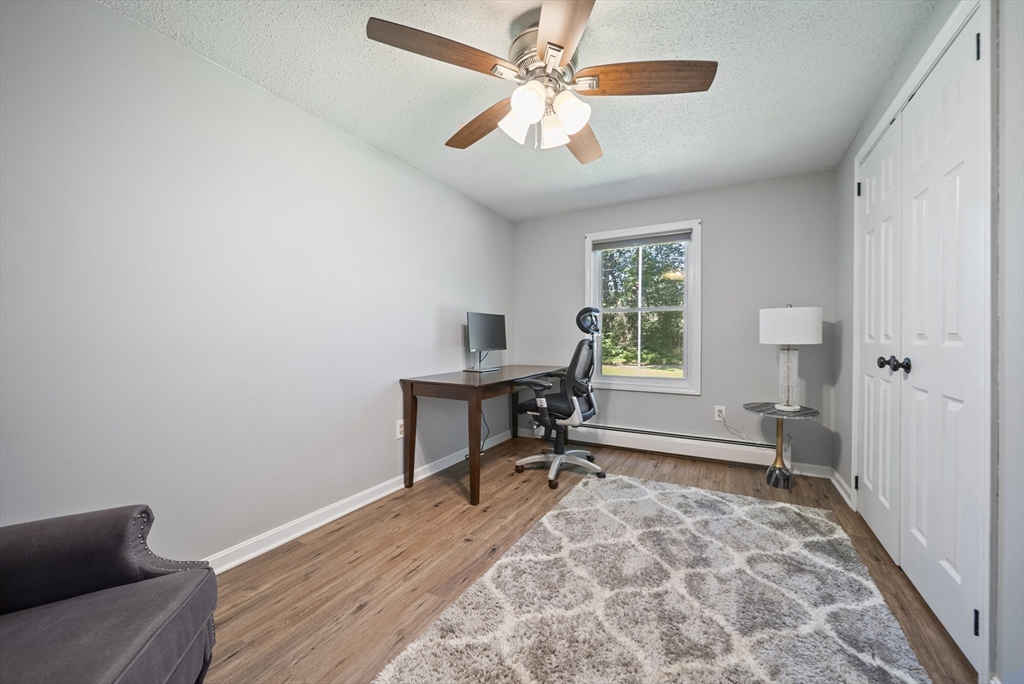 21 Woodman Road Amesbury, MA 01913 - Photo 12 of 30 a view of a workspace with furniture and a window