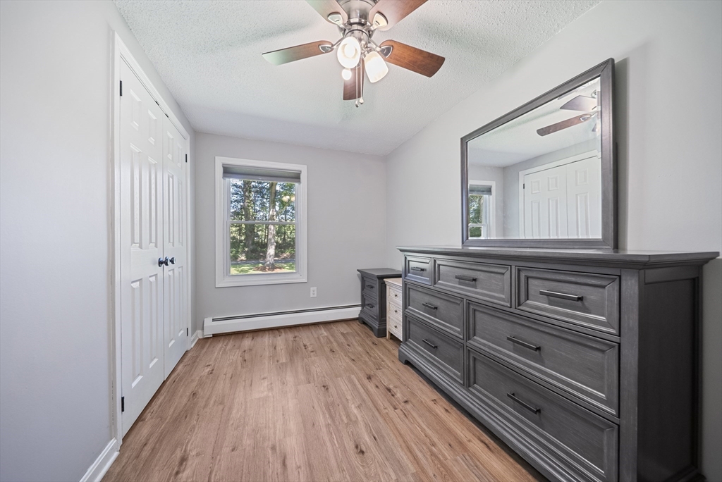 21 Woodman Road Amesbury, MA 01913 - Photo 13 of 30 a view of room with window and wooden floor