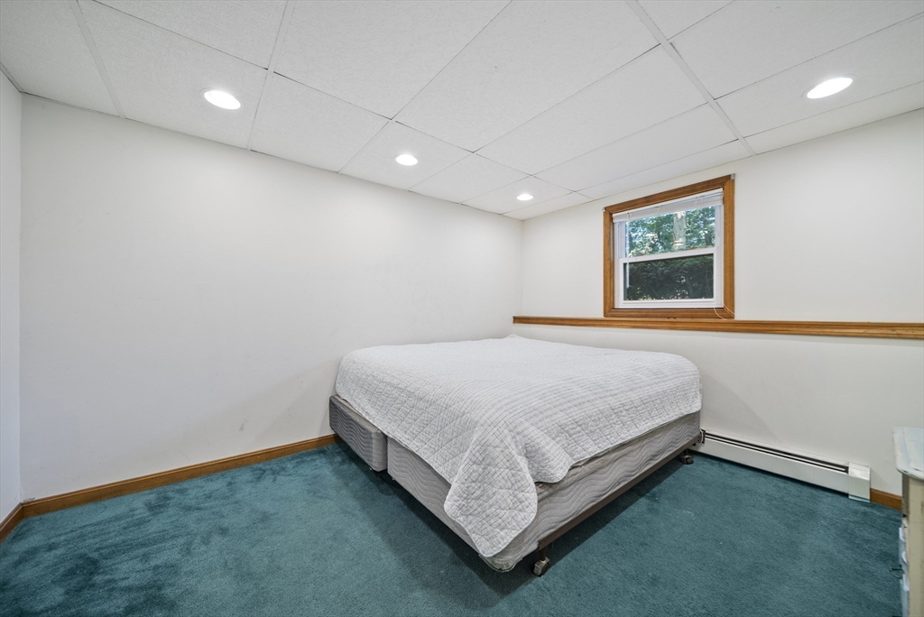21 Woodman Road Amesbury, MA 01913 - Photo 18 of 30 a bed room with a bed and a window