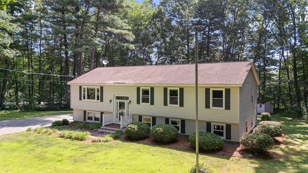 21 Woodman Road Amesbury, MA 01913 - Photo 24 of 30 a front view of a house with a yard