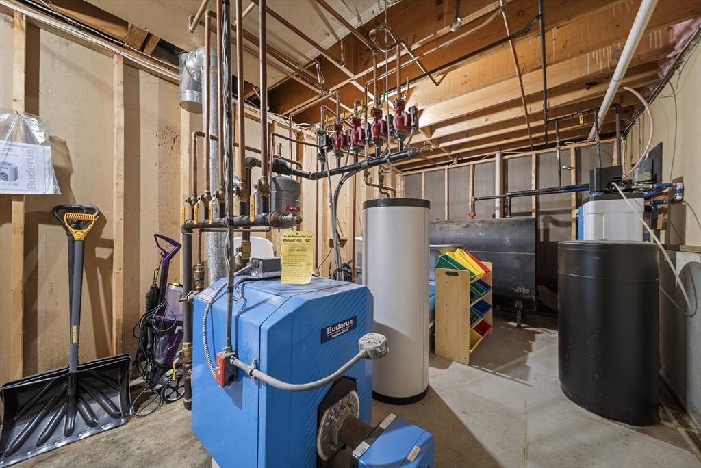 21 Woodman Road Amesbury, MA 01913 - Photo 28 of 30 a utility room with dryer and washer