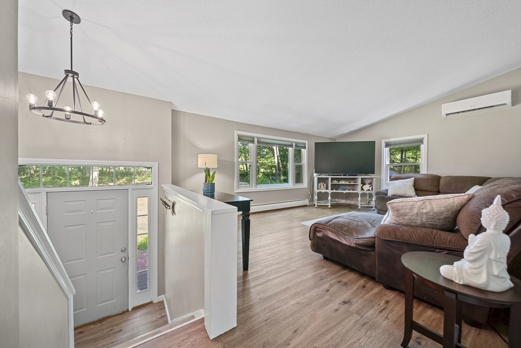 21 Woodman Road Amesbury, MA 01913 - Photo 7 of 30 a living room with furniture and a wooden floor