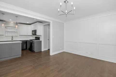 a view of kitchen with sink microwave and stove
