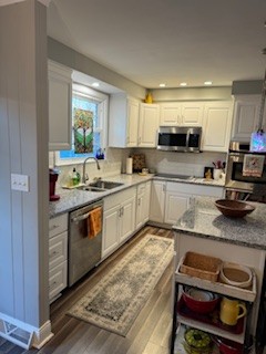 314 Kimbrough Road Clarksville, TN 37043 - Photo 10 of 29 a kitchen with a sink stove and cabinets