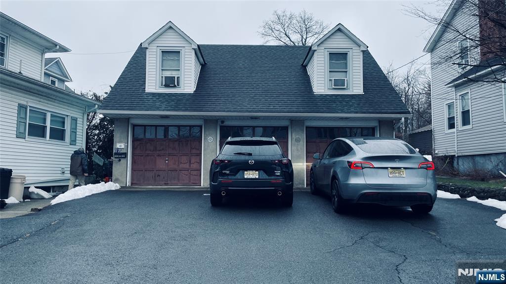 102 South Maple Avenue, Unit 3 Ridgewood, NJ 07450 - Photo 8 of 13 a car parked in front of a house