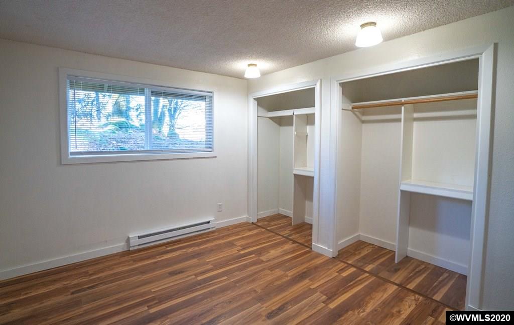 2401 Cole Road South Salem, OR 97306 - Photo 29 of 42 a view of empty room with wooden floor and fan