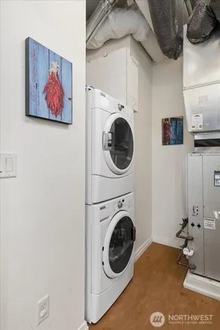 a view of a hallway with washer and dryer