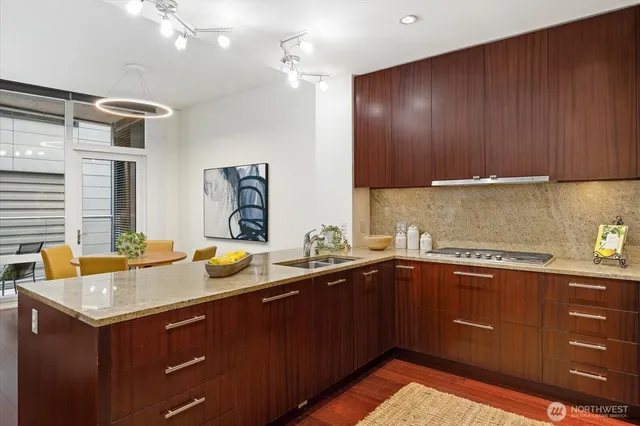 a kitchen with a sink and cabinets