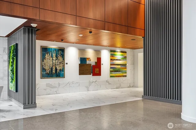 a view of a room with a window and brick walls