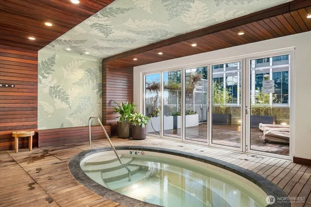 a swimming pool with potted plants