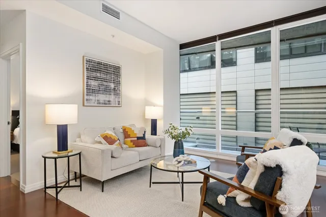 a bedroom with furniture and a window