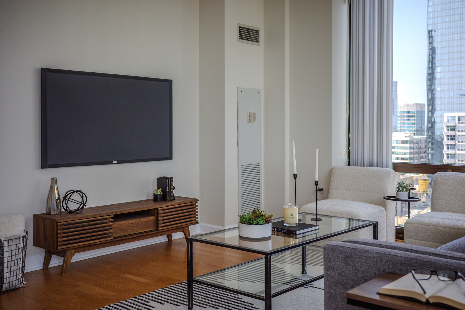 233 East 13th Street, Unit 2001 Chicago, IL 60605 - Photo 18 of 48 a living room with furniture and a flat screen tv