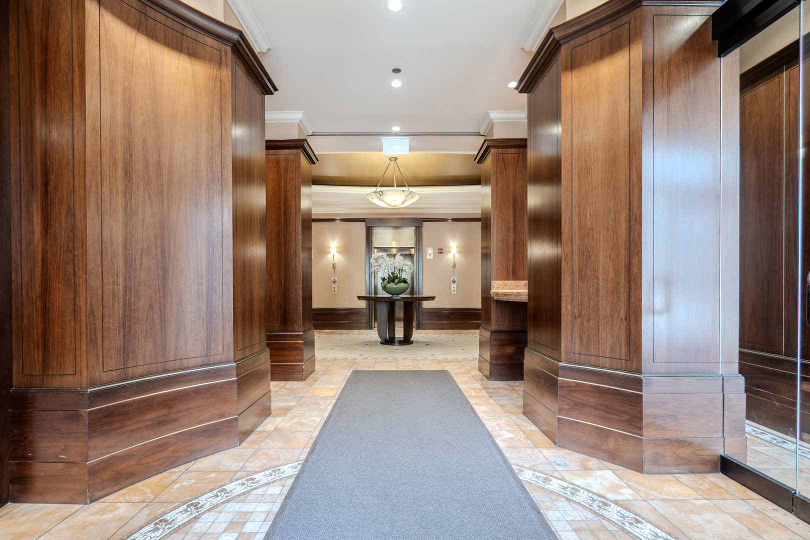 233 East 13th Street, Unit 2001 Chicago, IL 60605 - Photo 4 of 48 a view of a lobby with black carpet