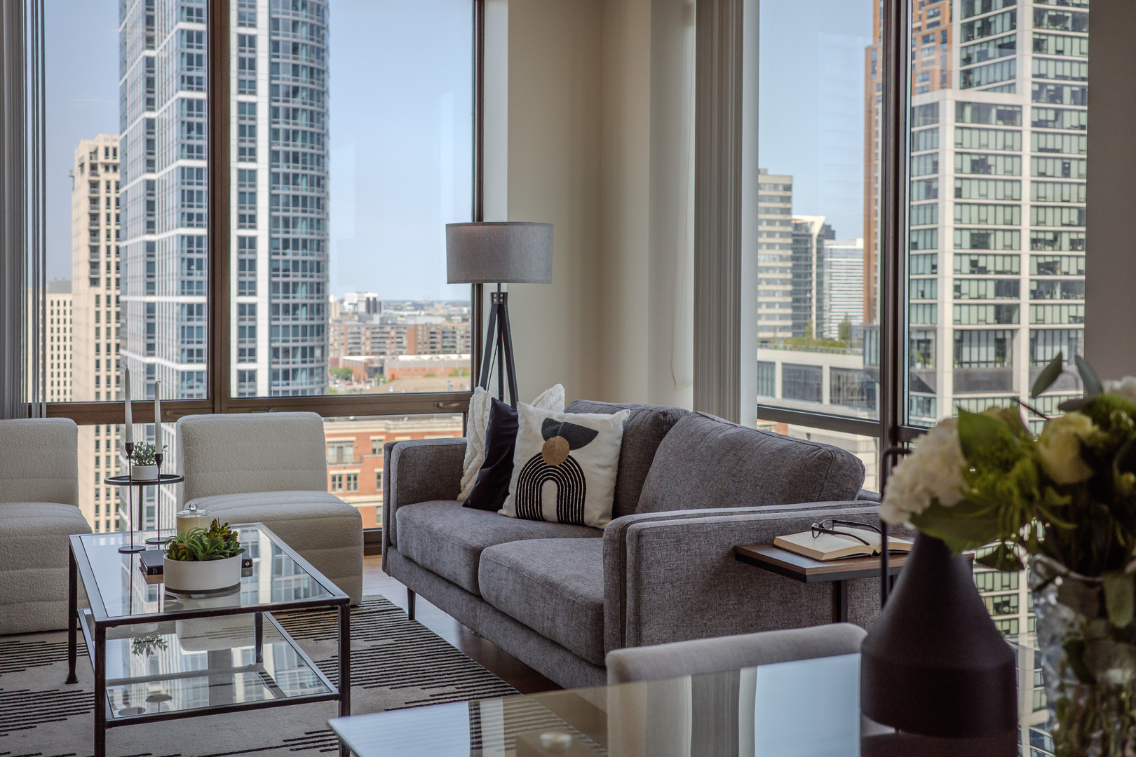 233 East 13th Street, Unit 2001 Chicago, IL 60605 - Photo 9 of 48 a living room with furniture and a window