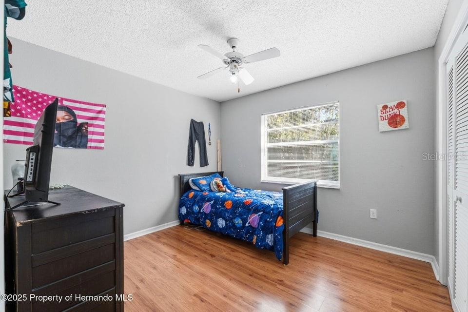 10290 Adler Street Spring Hill, FL 34608 - Photo 23 of 34 a living room with furniture and a window