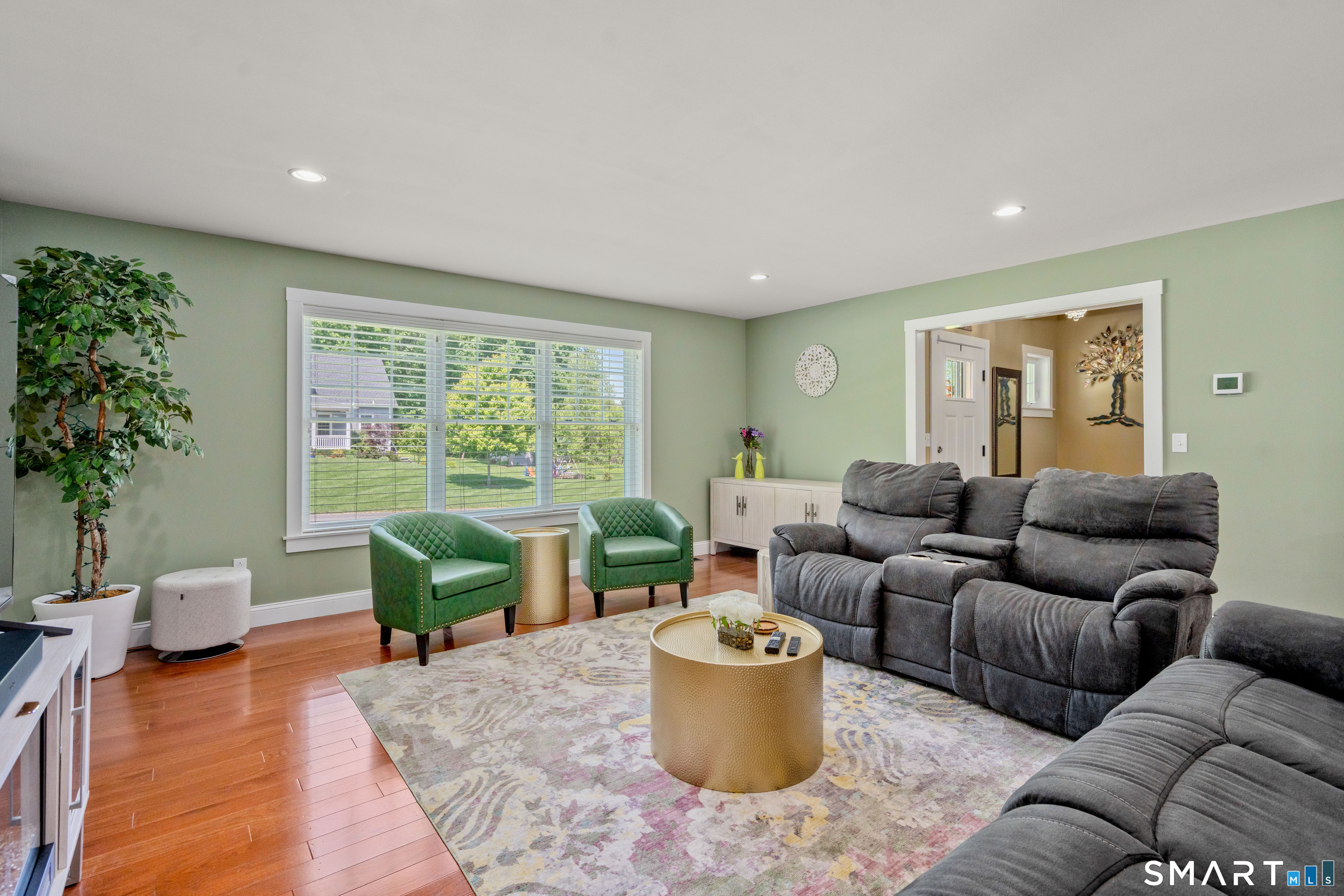 5 Limric Lane Suffield, CT 06078 - Photo 4 of 36 a living room with furniture and a potted plant