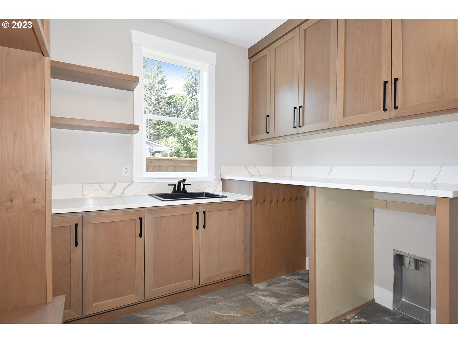14915 Northeast 40th Street Vancouver, WA 98686 - Photo 12 of 17 a kitchen with sink cabinets and a window