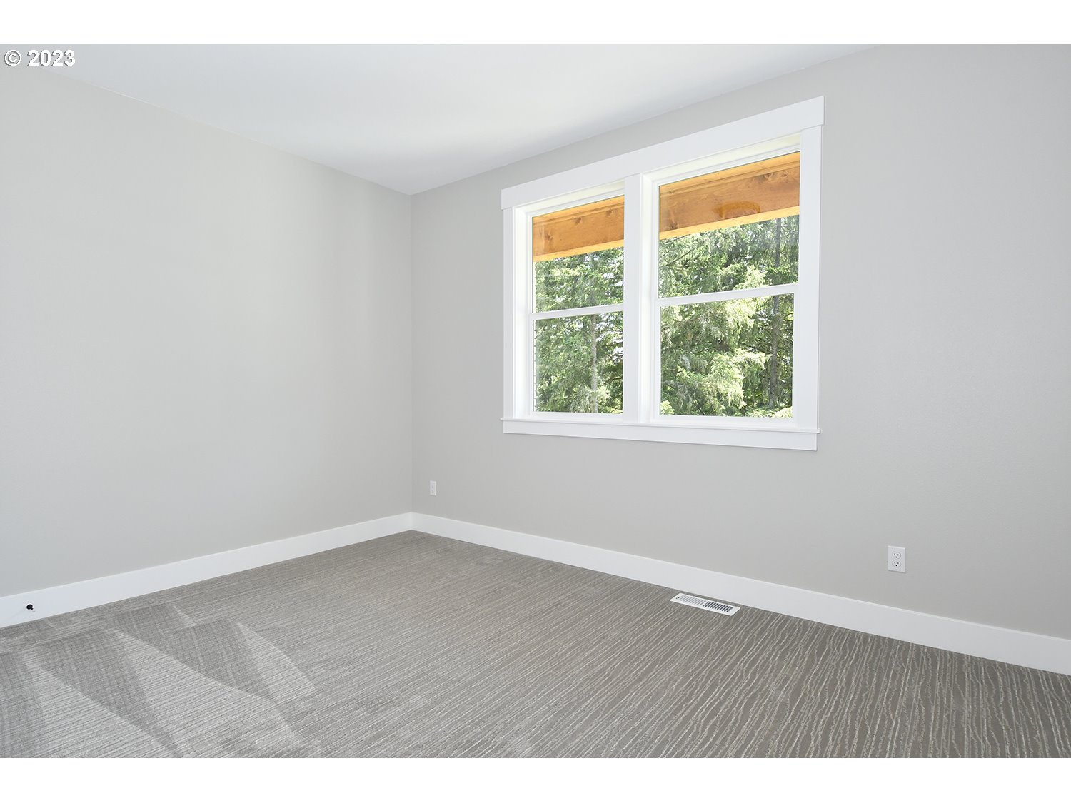 14915 Northeast 40th Street Vancouver, WA 98686 - Photo 14 of 17 an empty room with wooden floor and windows