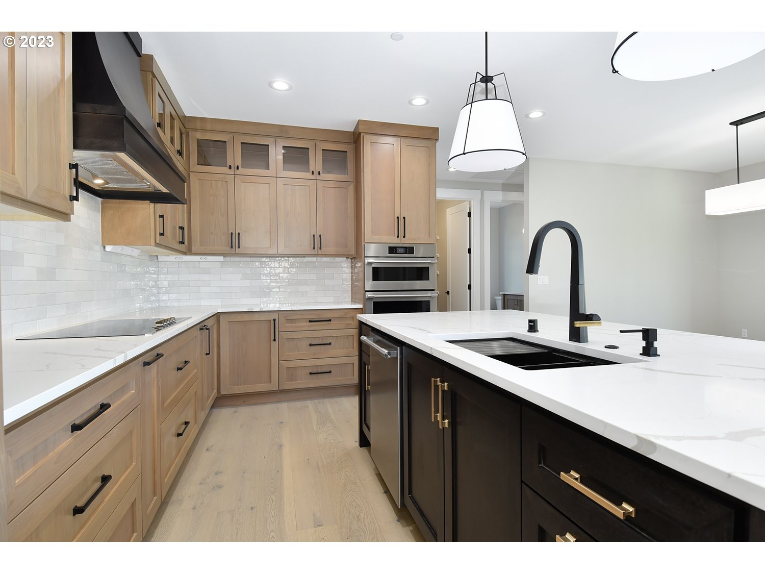 14915 Northeast 40th Street Vancouver, WA 98686 - Photo 6 of 17 a kitchen with kitchen island a sink stainless steel appliances and cabinets