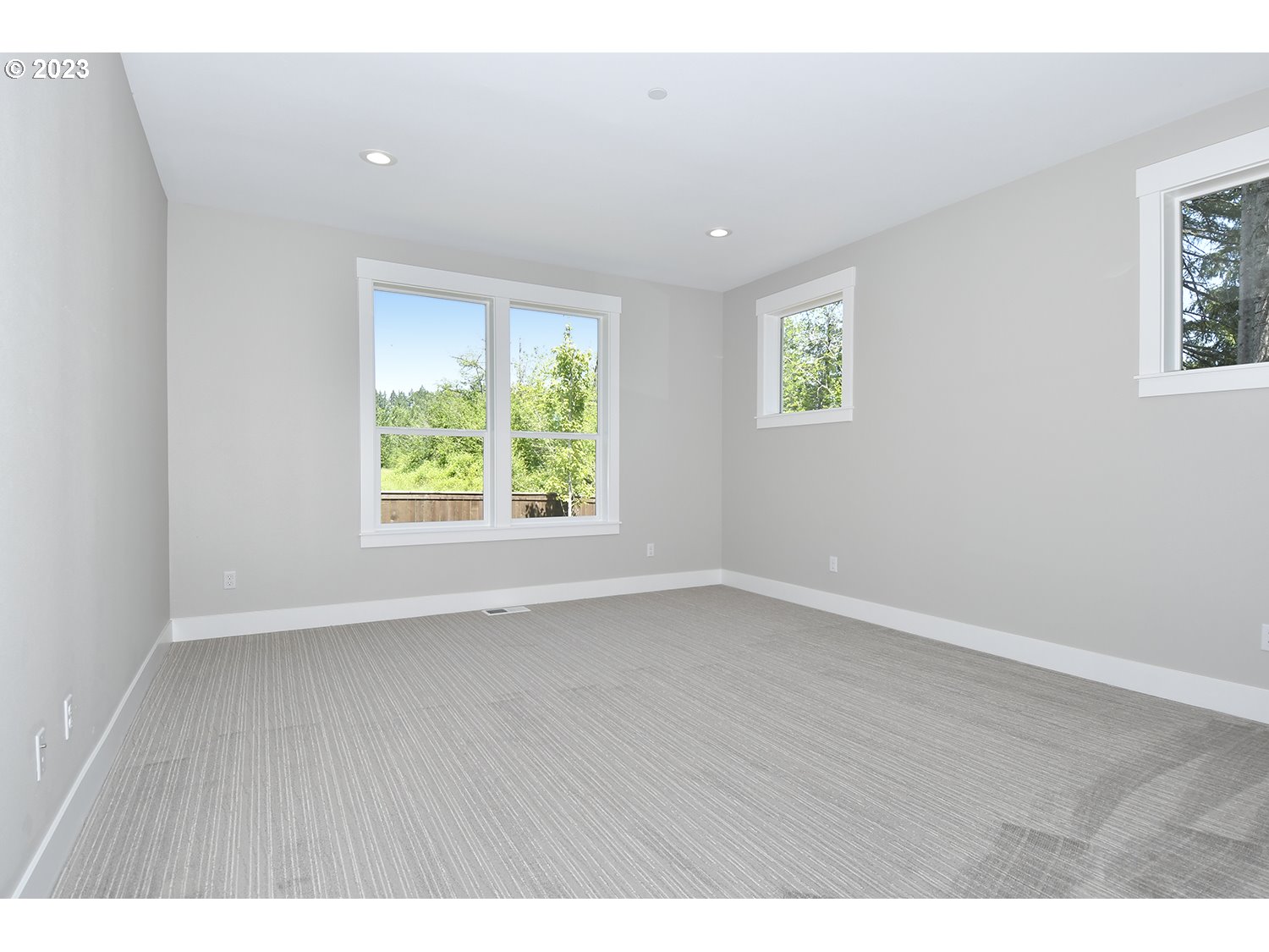 14915 Northeast 40th Street Vancouver, WA 98686 - Photo 8 of 17 an empty room with wooden floor and windows