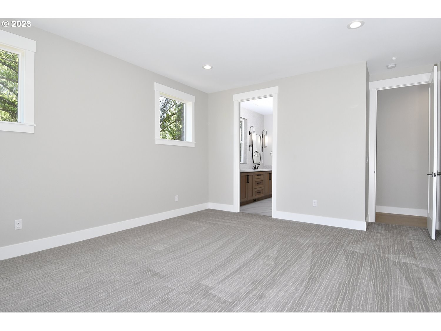 14915 Northeast 40th Street Vancouver, WA 98686 - Photo 9 of 17 an empty room with wooden floor and windows