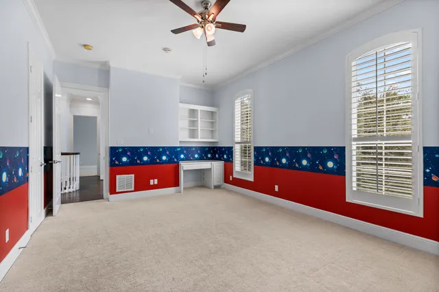 a living room with stainless steel appliances kitchen island furniture and a fireplace