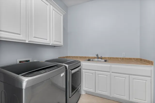 a utility room with cabinetry